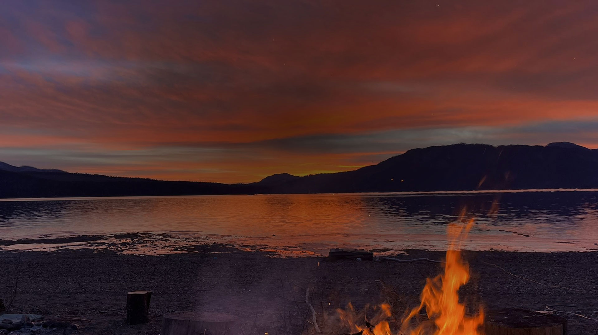 Campfire on lake beach