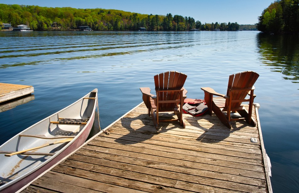 Chairs in a sunny day next to lake