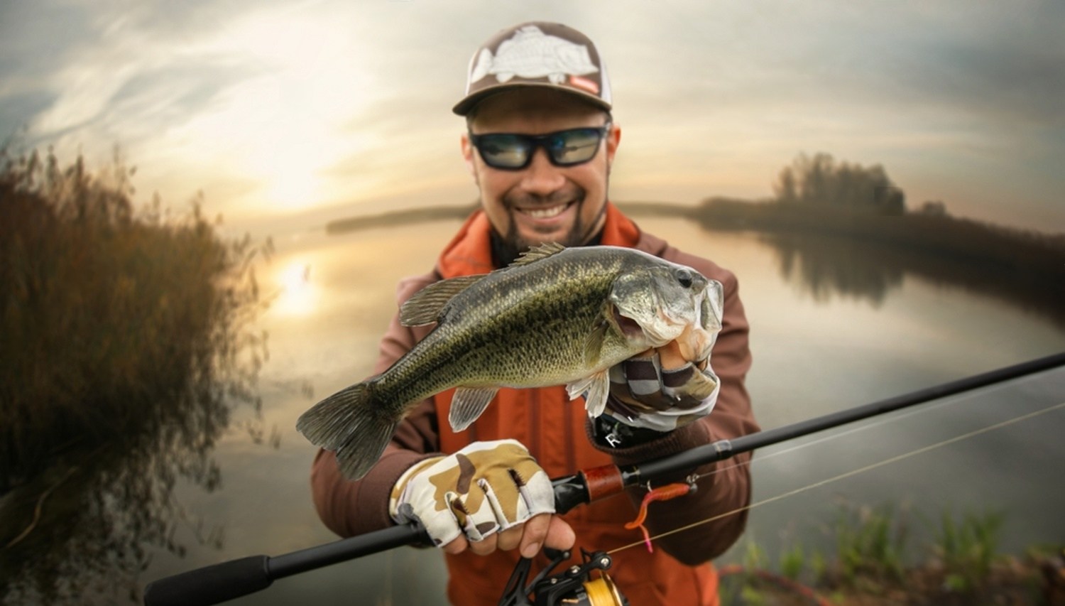 Fisherman with fish sunset