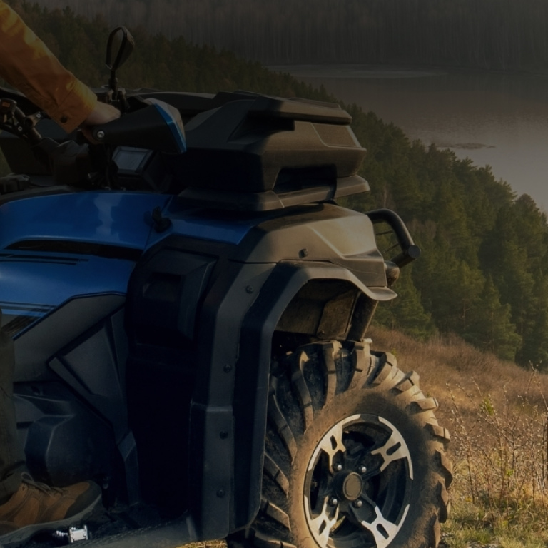 Person riding atv sunset