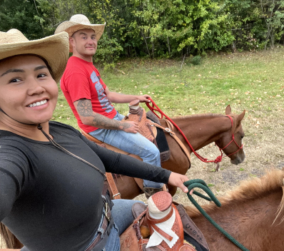 Woman and man riding horse