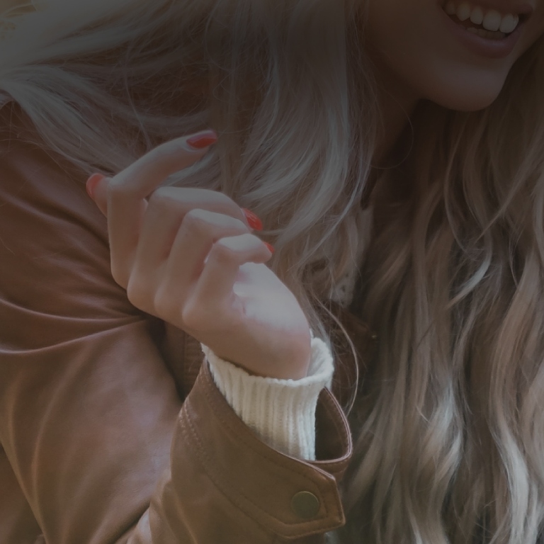 Woman wearing coat and smiling