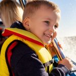 Boy wearing life jacket 150x150