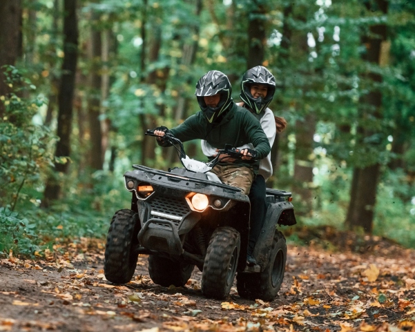 Couple riding atv