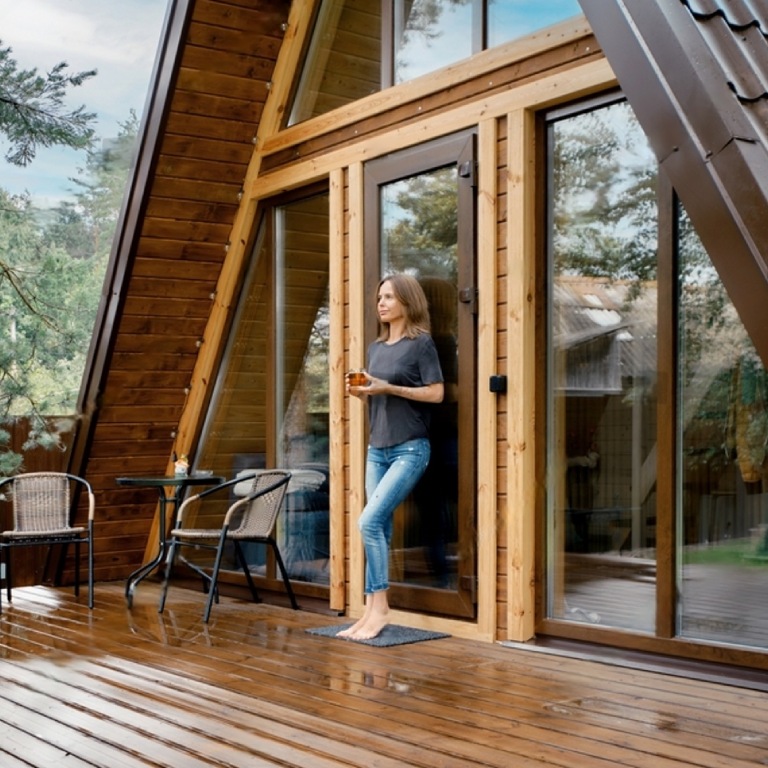 Woman drinking tea on her cabin