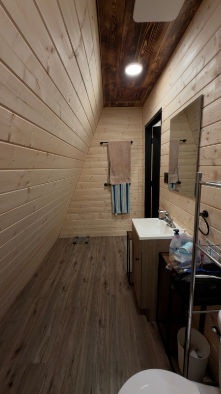 Wooden washroom inside a lodge at Sustutdene Eco Resort